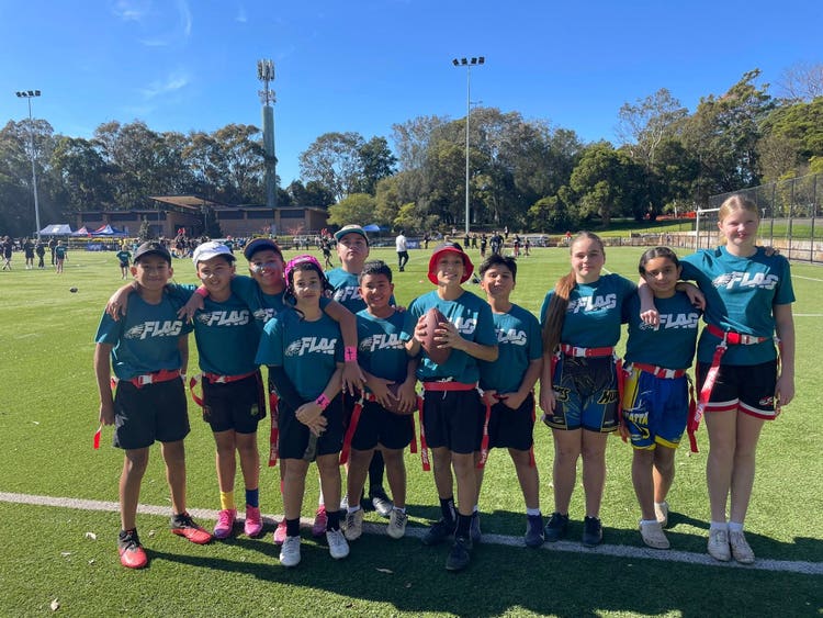 May be an image of 9 people and people playing American football