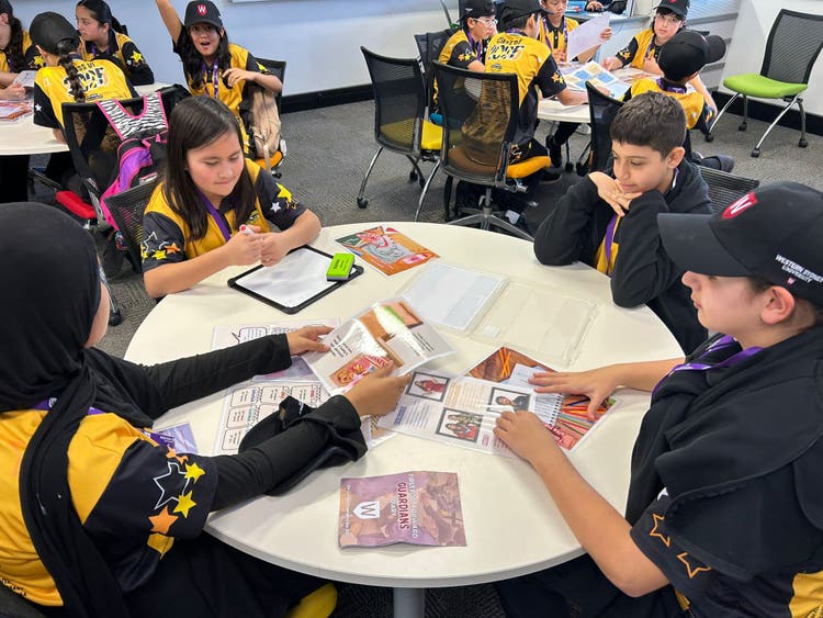 May be an image of 10 people, people studying and text