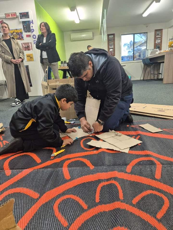 May be an image of 4 people and people studying